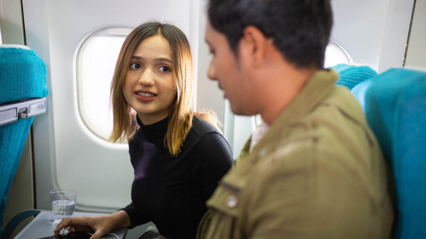 woman annoyed with fellow plane passenger