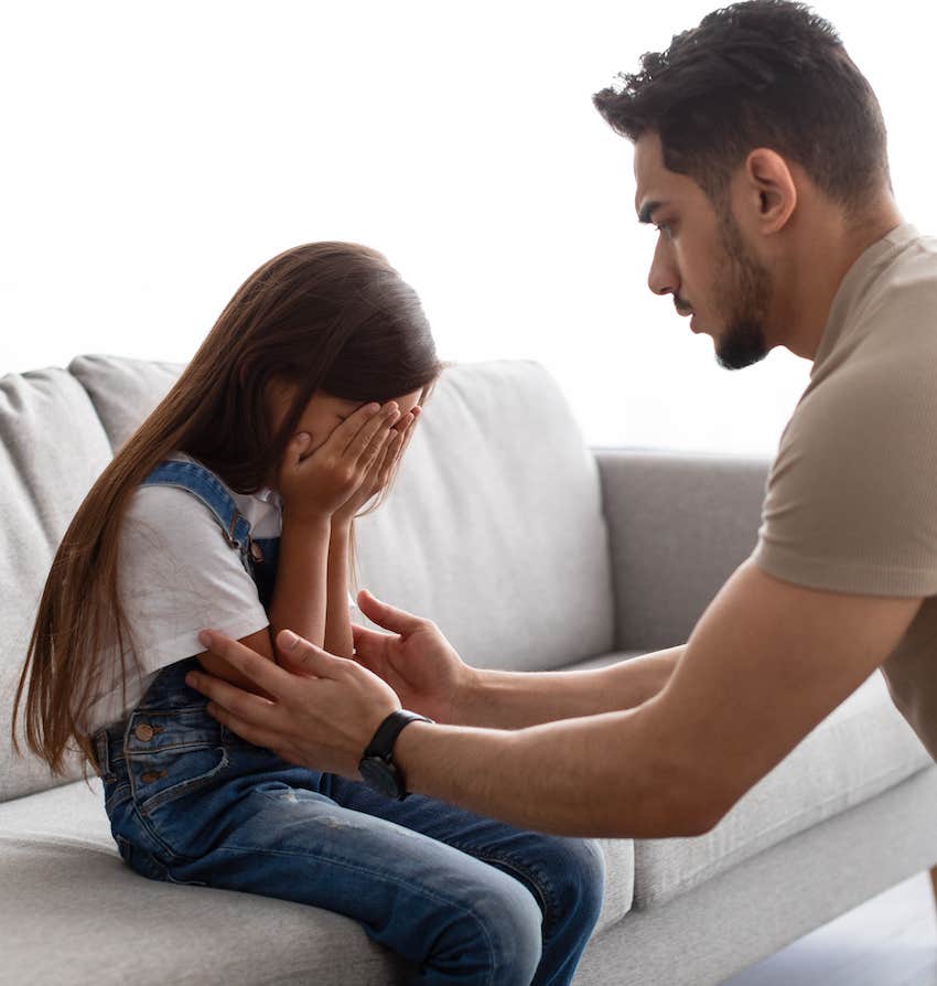 Father comforts daughter during crisis
