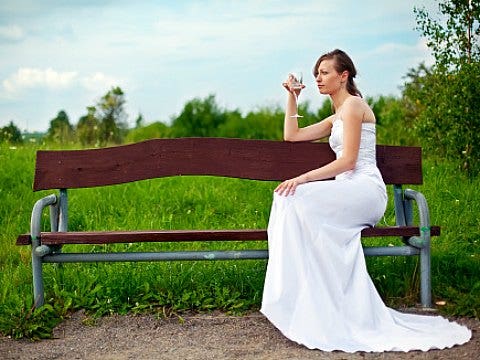 lonely woman in wedding dress