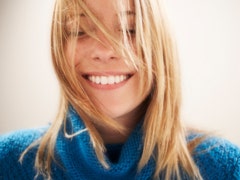 Smiling woman blue sweater