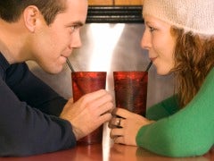 Couple drinking soda