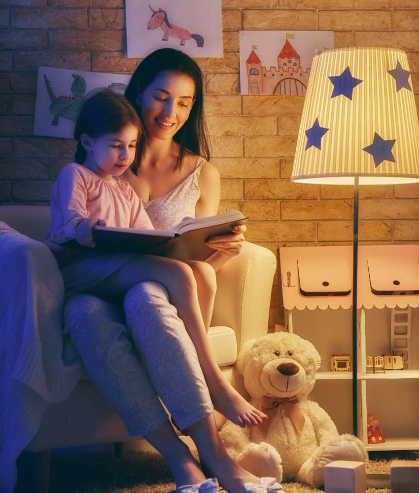 mom reading to daughter at bedtime