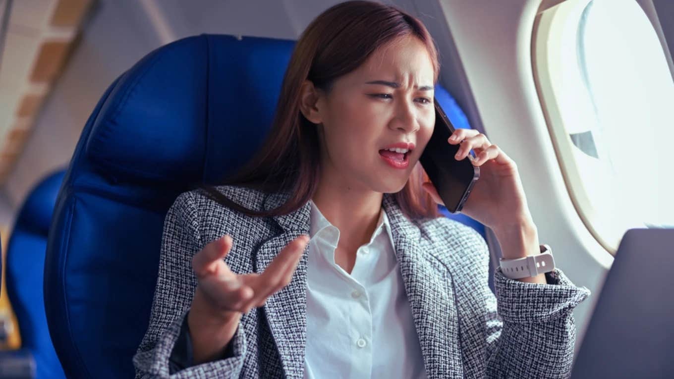 woman on phone on airplane complaining about flight attendants