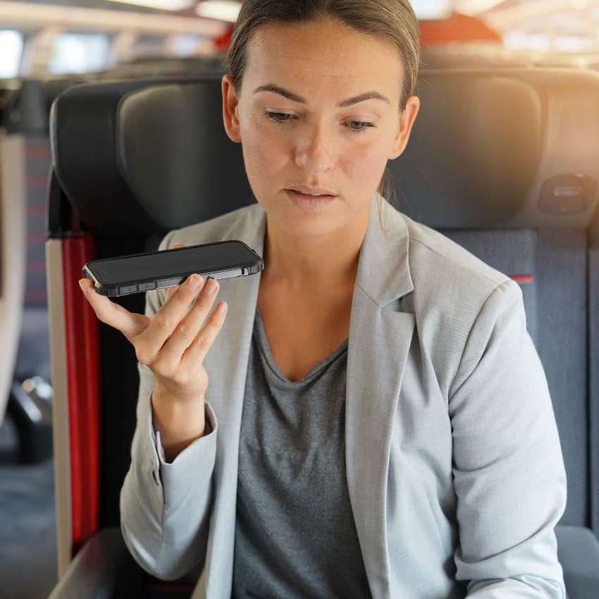 Woman talking on speakerphone on the train
