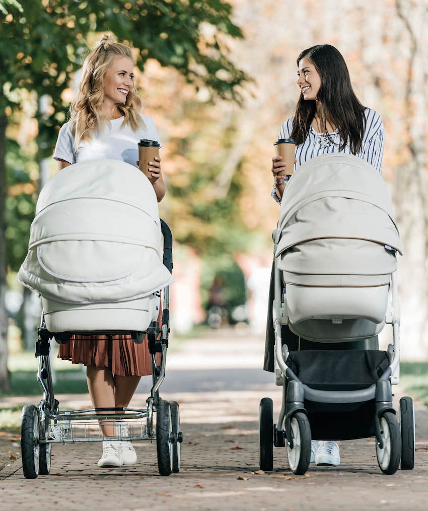 Two moms with baby carriages consider karmic relationships