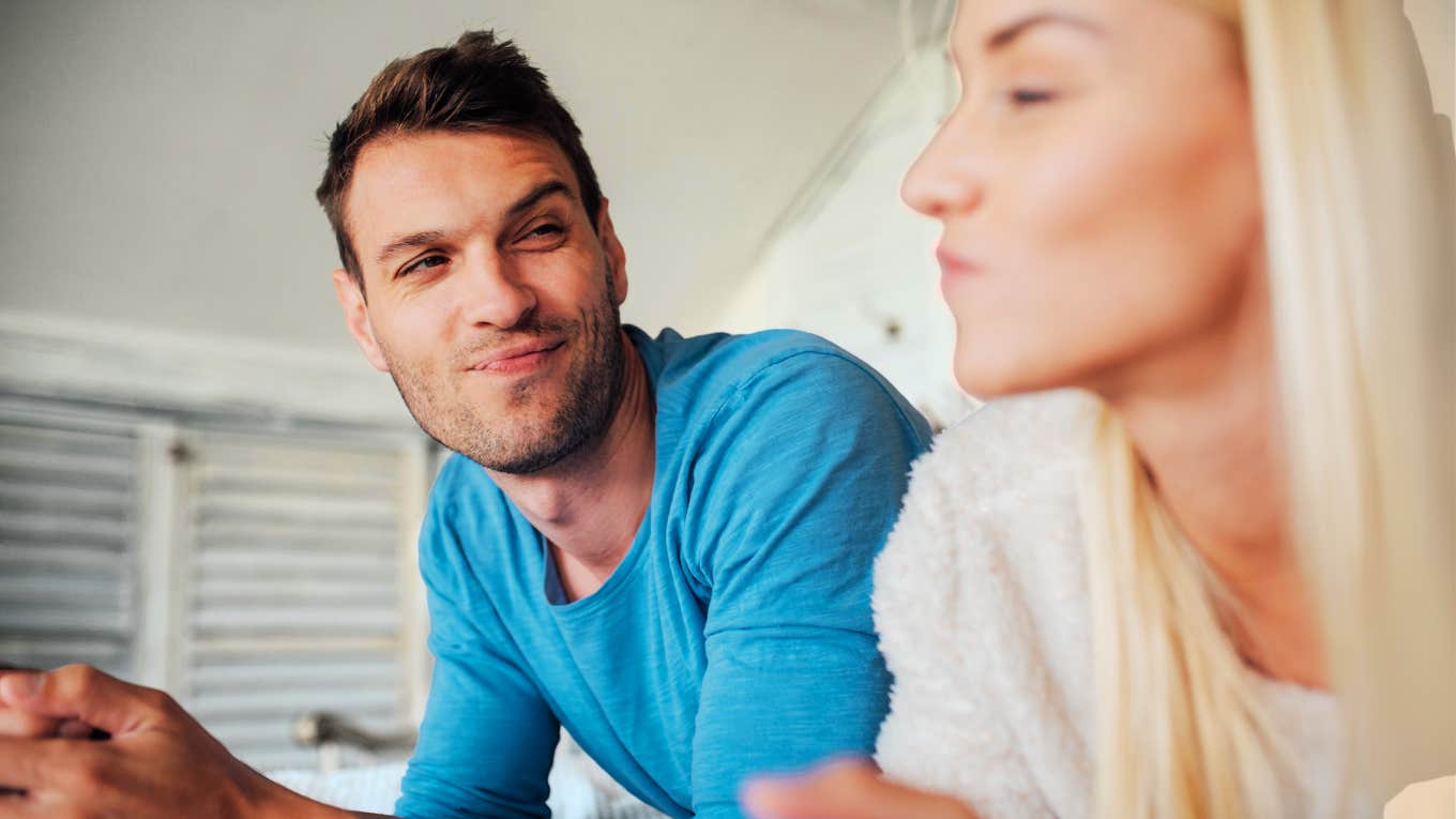 Charming Things Men Do That Women Simply Can't Resist, According To Psychology Charming man being flirty with woman.