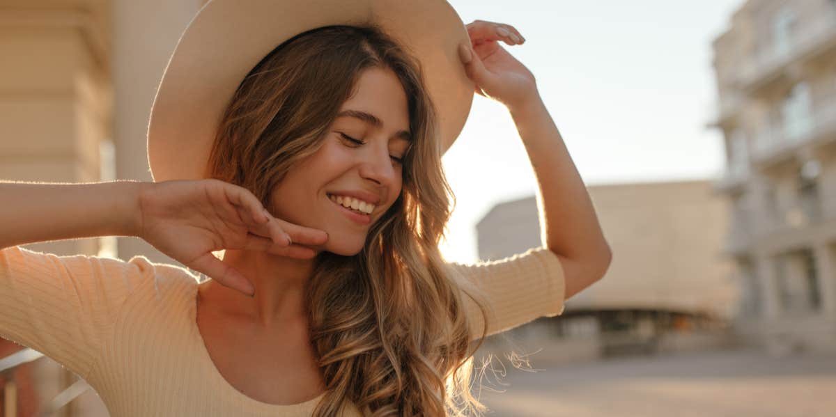 8 Toxic Thoughts That Absolute Sabotage Your Happiness smiling woman