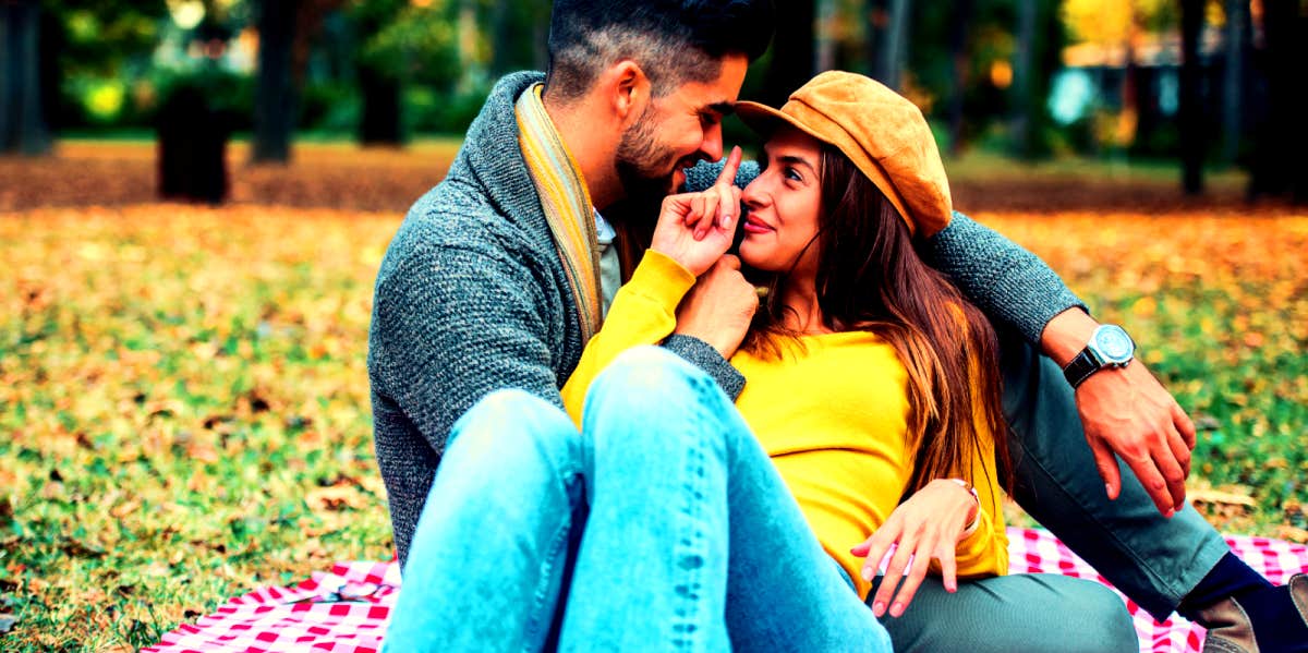 man and woman having a picnic date