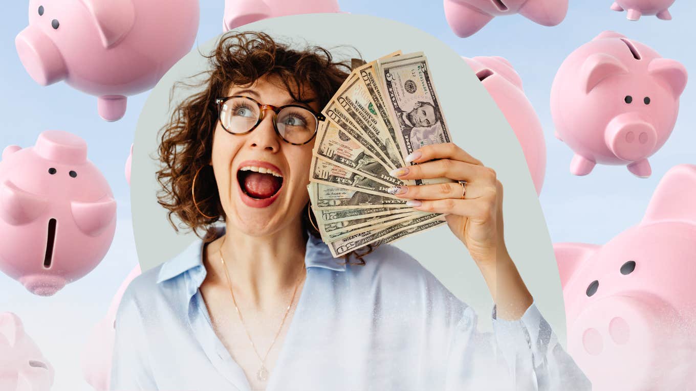 ecstatic woman holding a stack of cash