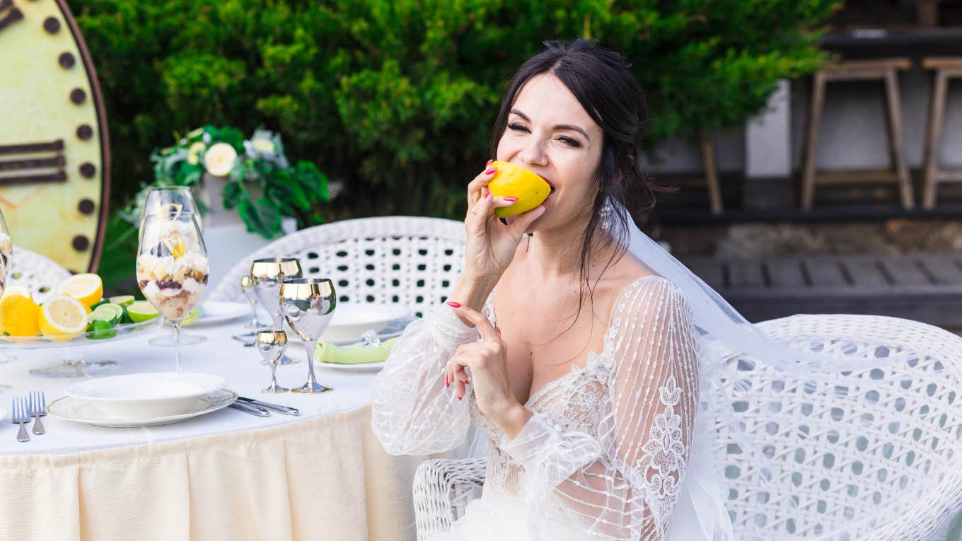 Bride eating at reception