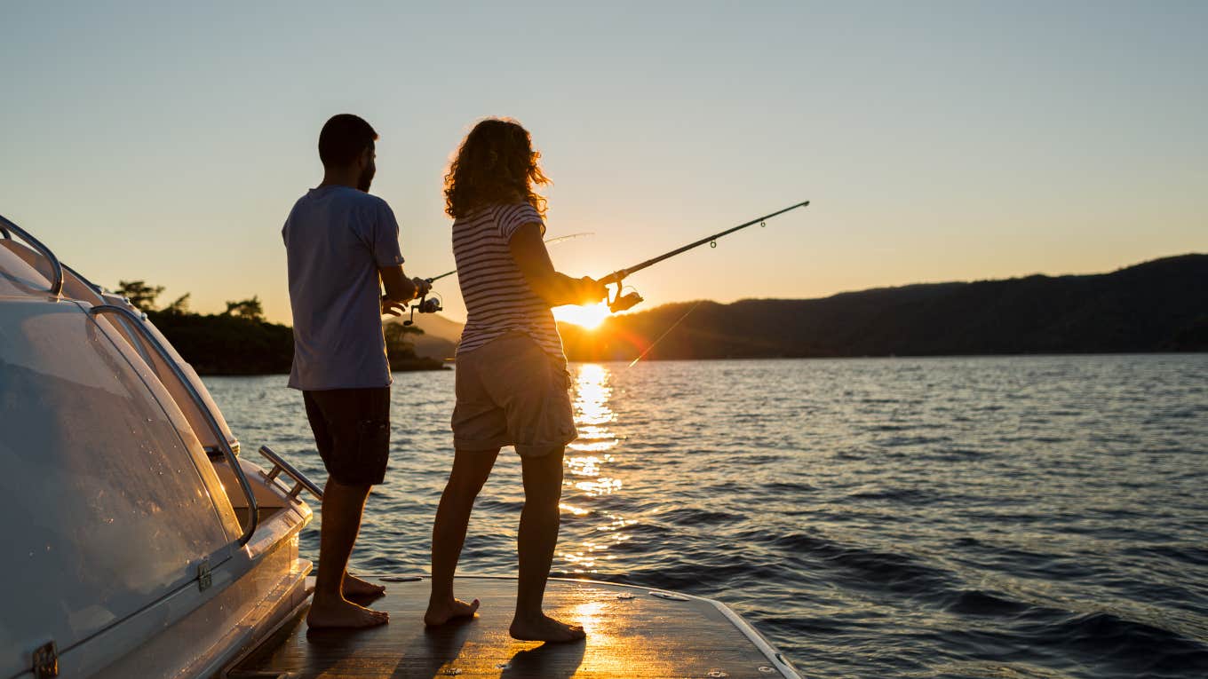 couple fishing during sunset