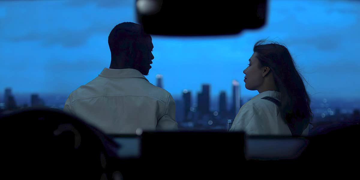couple at night overlooking view