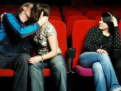 couple kissing at the movies