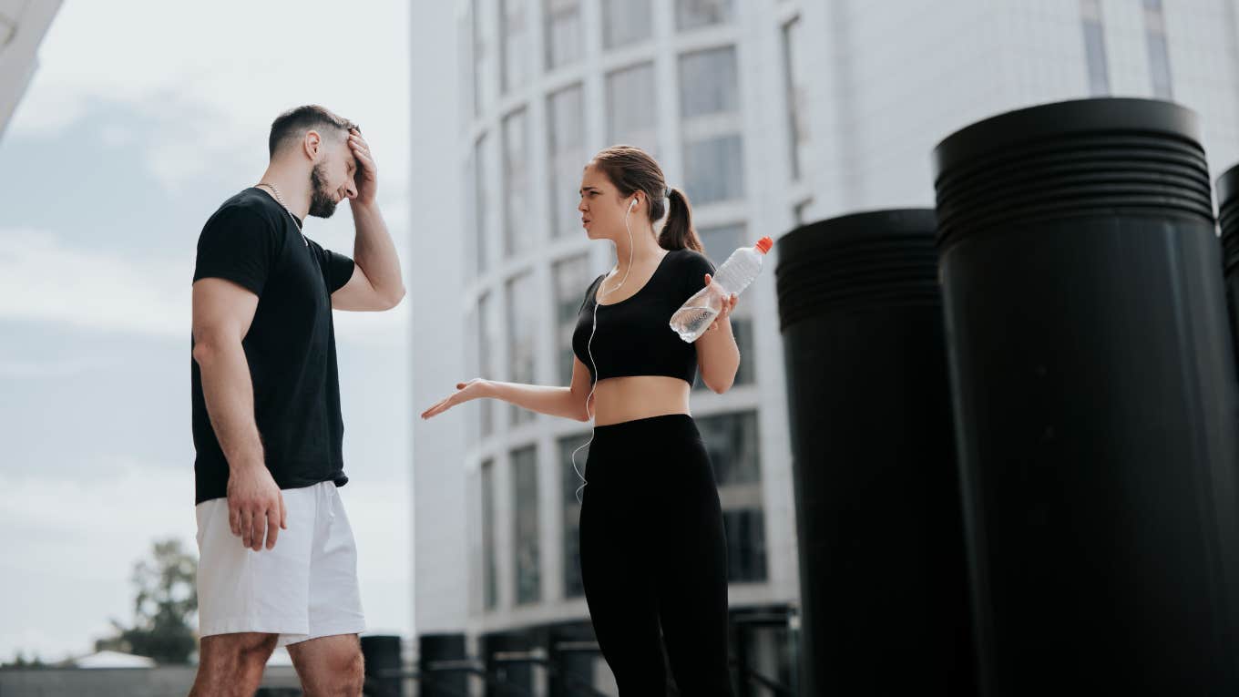 man and woman arguing at the gym