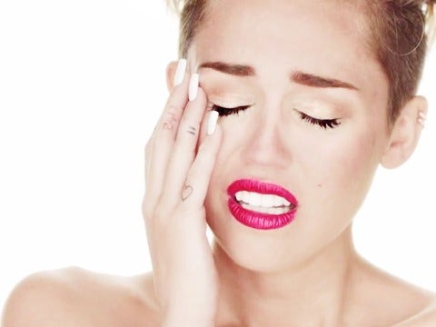 Miley Cyrus naked in her "Wrecking Ball" video