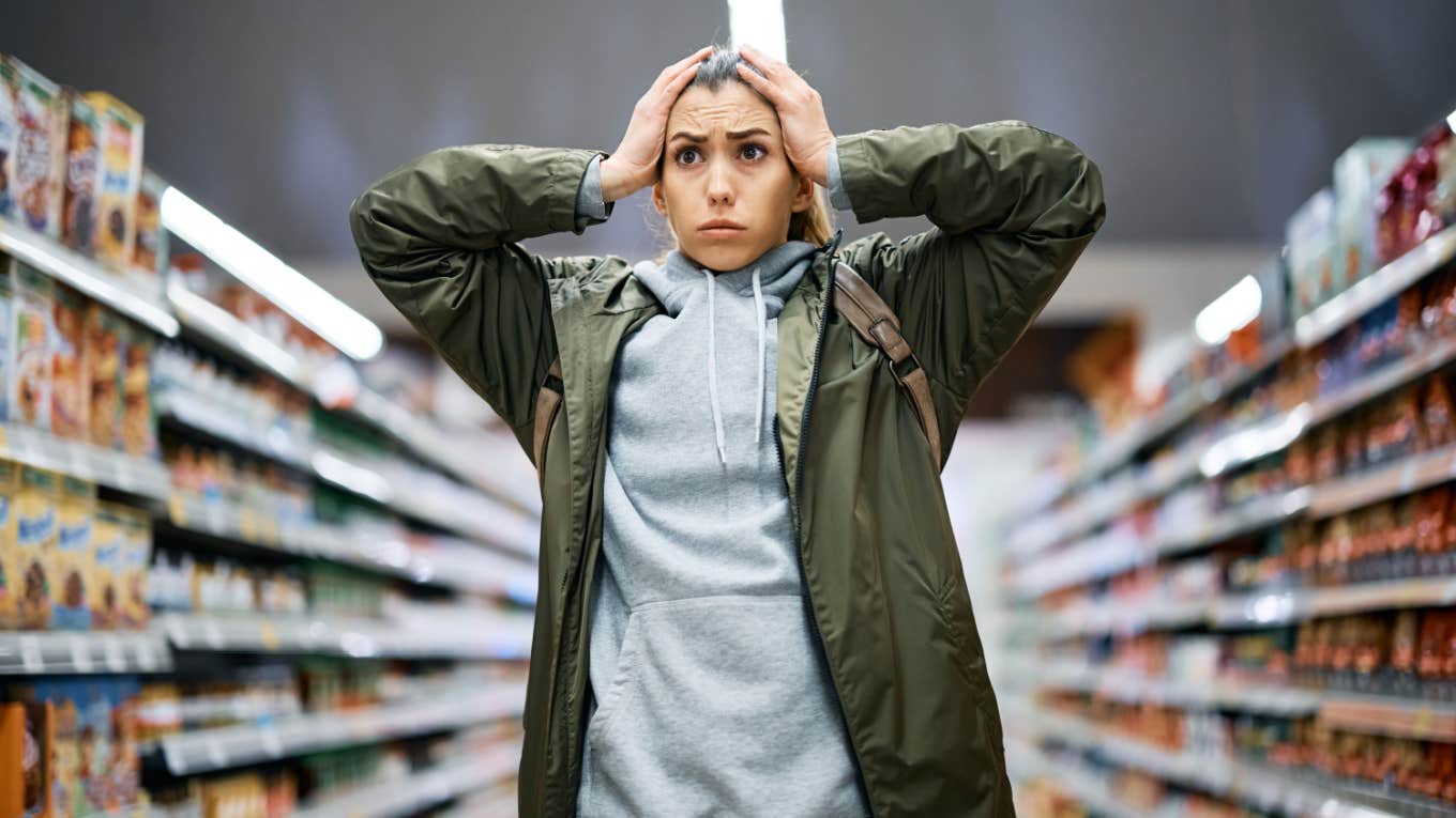 woman feels stressed at grocery store