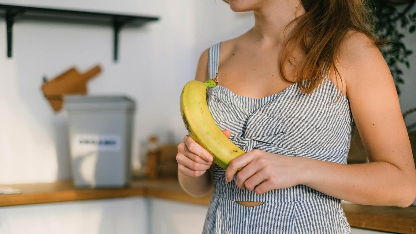 woman holding banana 