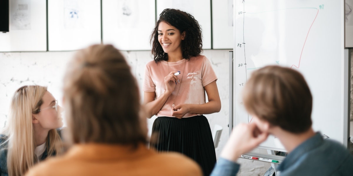 woman speaking to co-workers