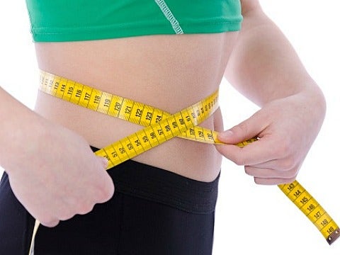 The Irony Of Thinspiration girl measuring waist