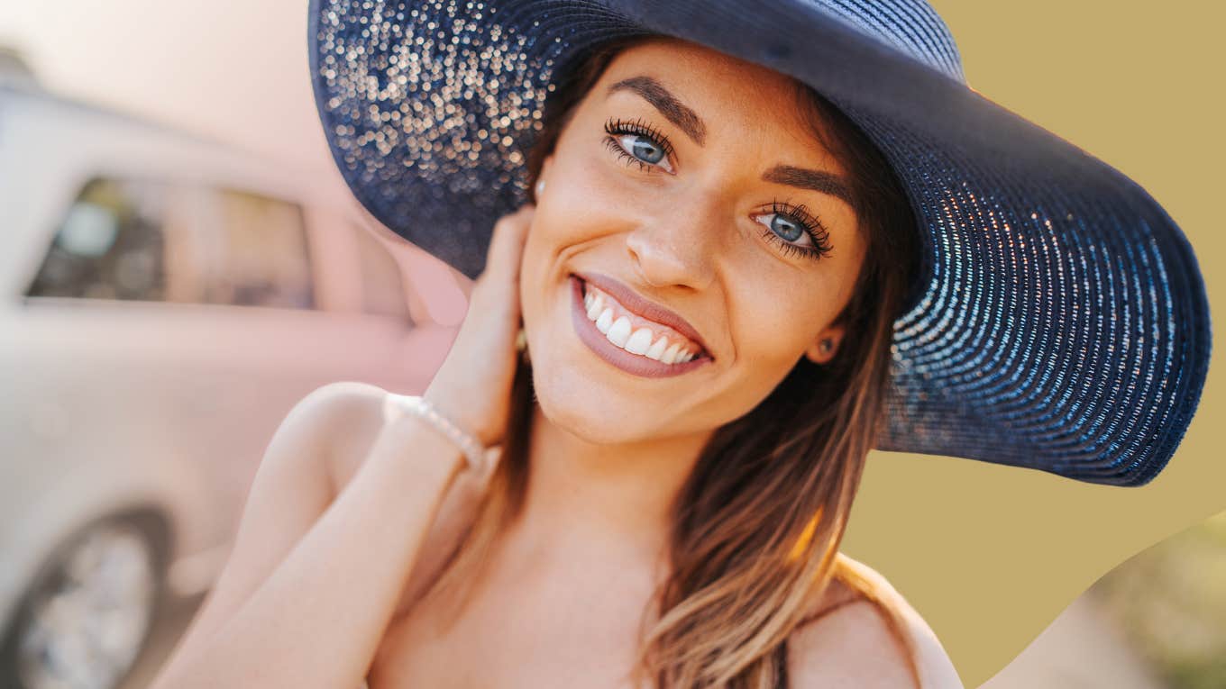 Happy woman in a sunhat 