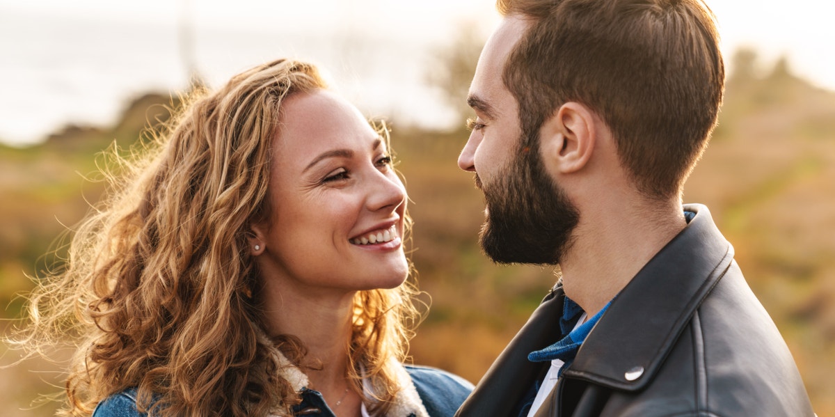 man and woman smiling at each other