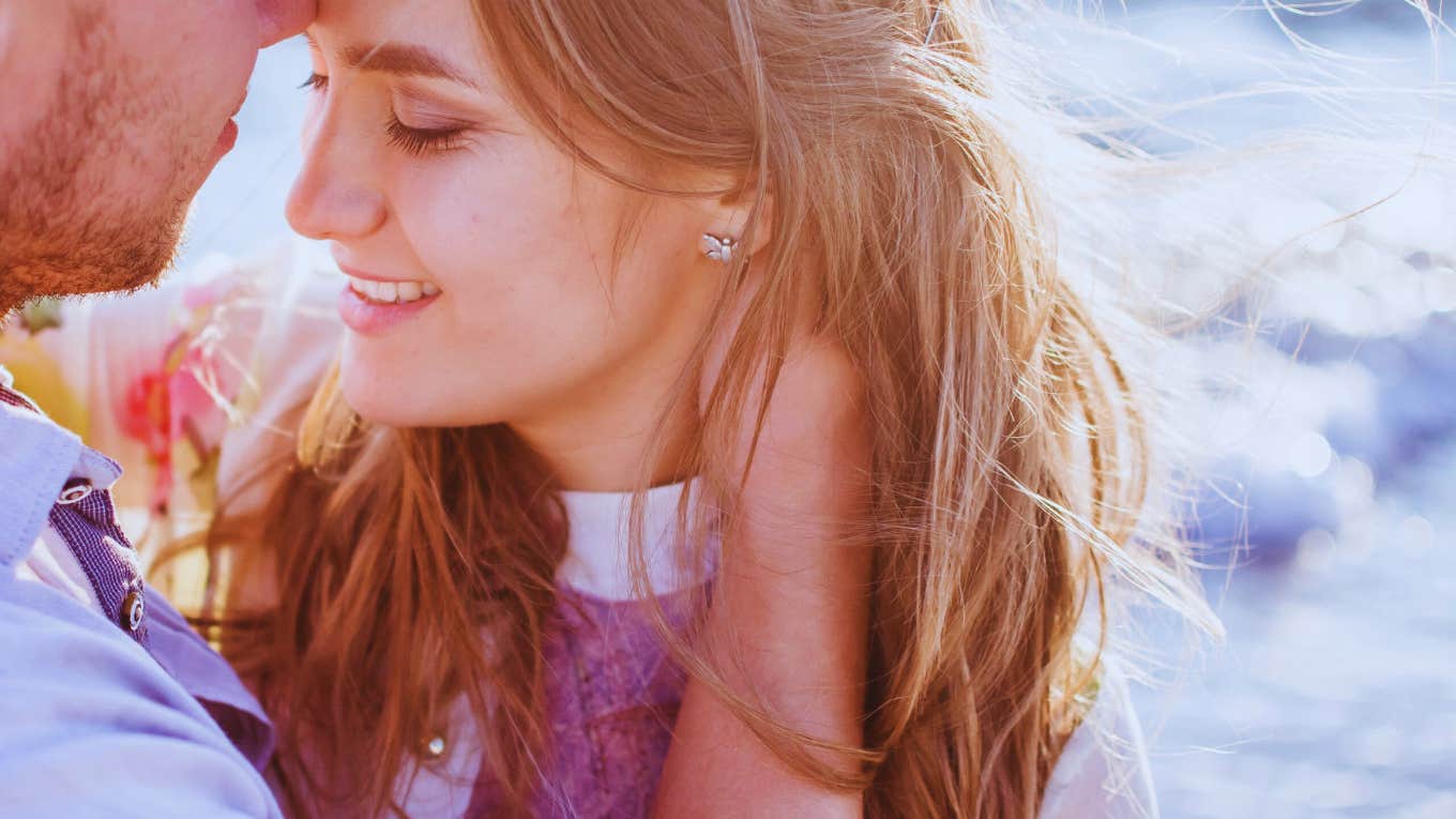 3 Unmistakable Signs A Man's In Love With You man holding woman close