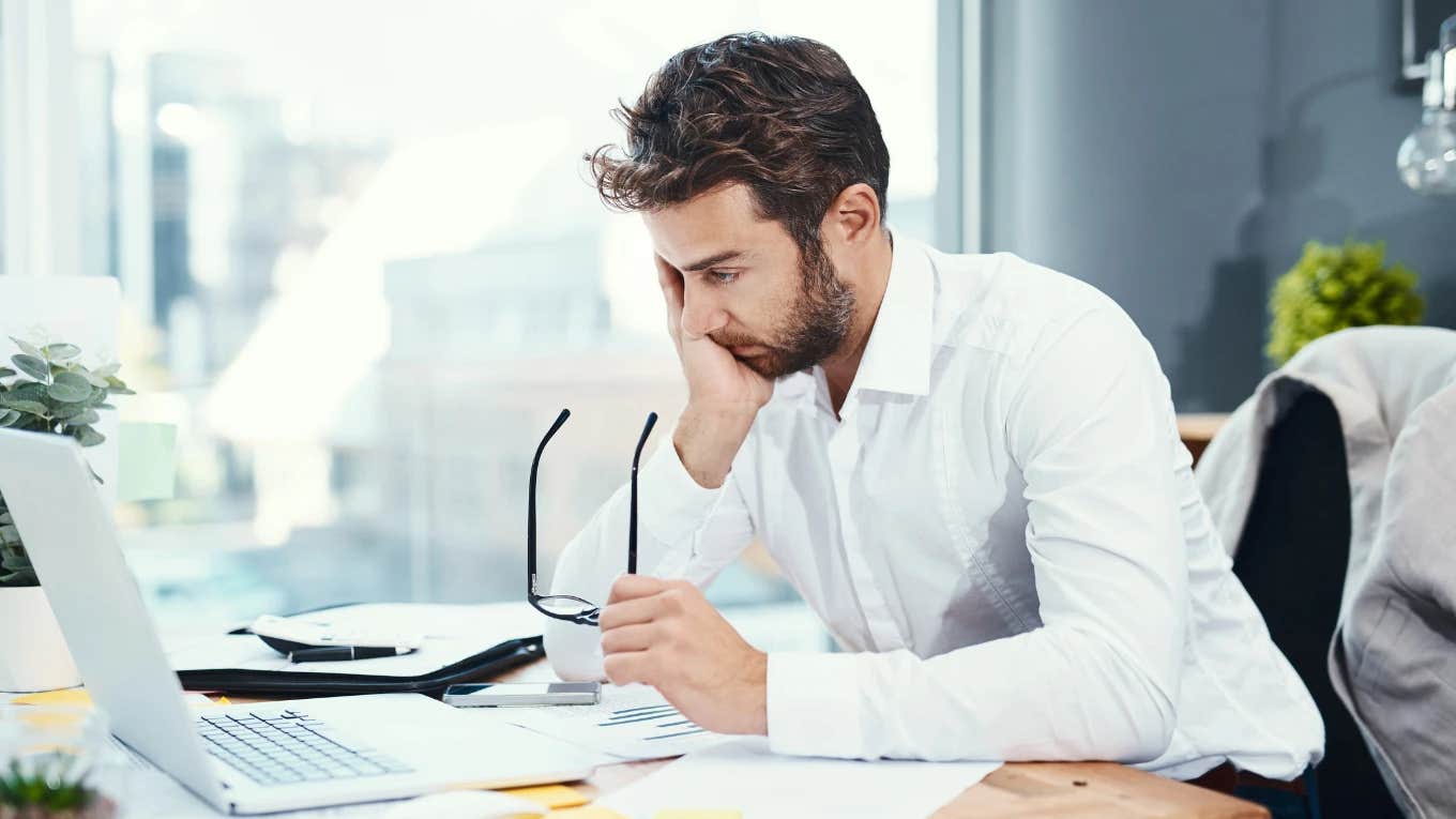 man disengaged and dissatisfied at work