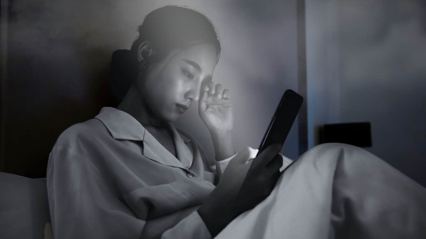 woman on her smart phone late at night