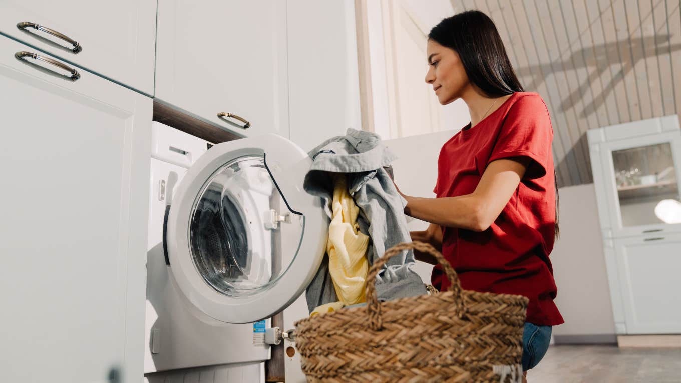 woman taking laundry out of dryer