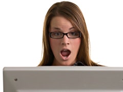shocked woman looking at computer