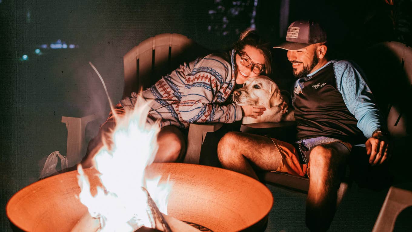 Couple enjoying time together by the campfire