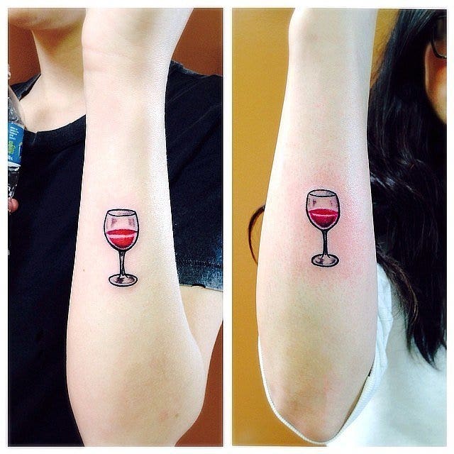 Glass of wine best friends matching tattoo 