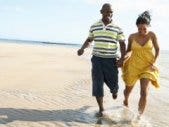 Is Your Summer Romance A Fling Or The Real Thing? Couple on beach