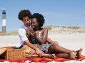 couple beach lighthouse picnic