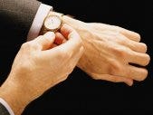man looking at watch
