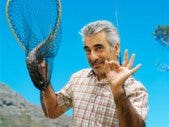 Man Chooses Fishing Over Family, Seems OK With It man with fishing net