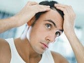 Surprise! Hair loss didn't make the list. man examining his hairline