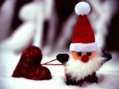 ini santa carrying a heart mini santa carrying a heart