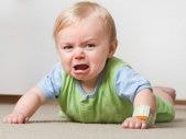 blonde baby screaming and crying