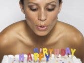 Love Advice For My Formerly Hot Self beautiful woman blowing out candles on birthday cake