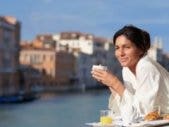woman enjoying breakfast outdoors