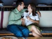 Oscars 2011: How To Make The Academy Awards A Date Night A couple on the couch watching the oscars 2011