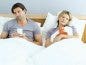 sad bored couple in bed with cold