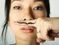 woman with finger mustache