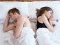 Unhappy Couple In Bed