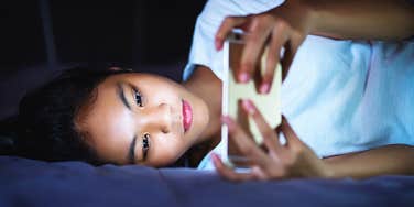 Teen girl sneaks around to use her phone at night