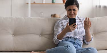 Confused woman reading a text