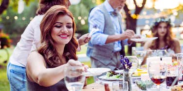 woman eating at wedding reception