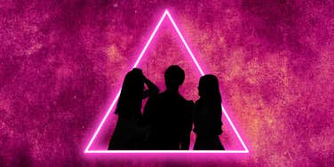 pink triangle with silhouette of three people in relationship
