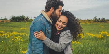 happy couple in a field